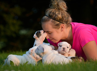 woman and litter of puppies