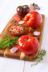 Tomatoes Bullish heart on cutting board