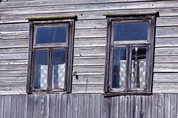 two old windows on farm wall