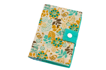 handmade notebook with a cover from a fabric and floral ornament on a white background