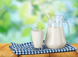 Milk, glass, tablecloth.