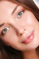 Obraz premium Close up portrait of beautiful young woman face. Isolated on