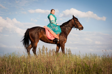 Horsewoman and blue sky