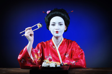 Woman in geisha makeup eating sushi