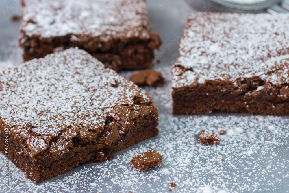 Wall mural brownie. chocolate cakes with powdered sugar