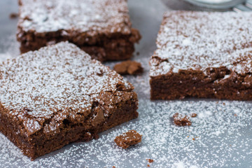 Brownie. Chocolate cakes with powdered sugar