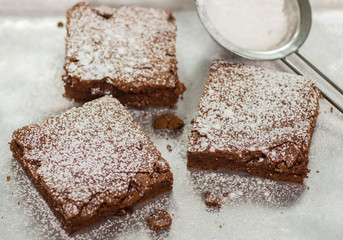 Brownie. Chocolate cakes with powdered sugar