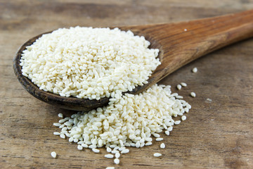 Sesame seeds in wooden spoon