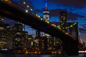 Brooklyn Bridge over East River at night in New York City