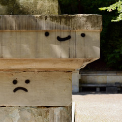Graffiti emoticons on the wall.