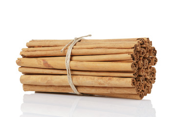tied true ceylon cinnamon sticks, isolated on white