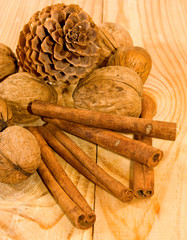  fir cones, cinnamon and walnuts