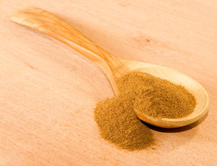 image of instant coffee in a wooden spoon
