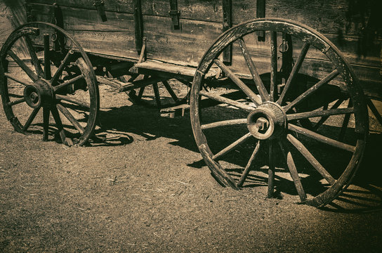 Old wagon wheel symbolic of American Wild West Cowboy concept