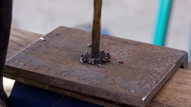 drilling holes in a metal workpiece