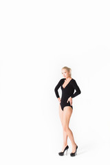 Fototapeta na wymiar Slender girl with long legs in black dress body