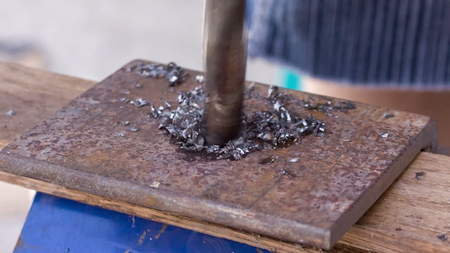 drilling holes in a metal workpiece