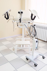 Gynecological chair in gynecological room