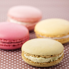 Macaroons on pattern background