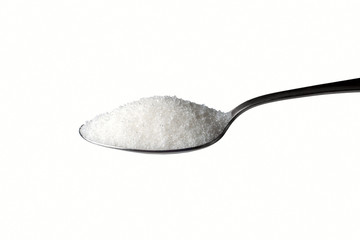sugar on the spoon on the white background