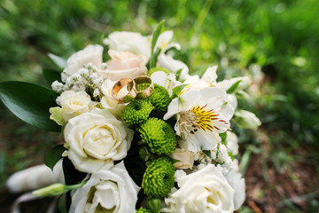 wedding bouquet at green grass