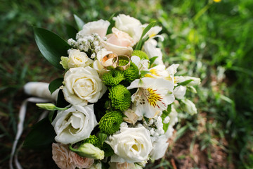 wedding bouquet at green grass