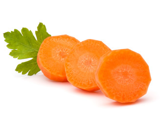 Chopped carrot slices and parsley herb leaves still life isolate