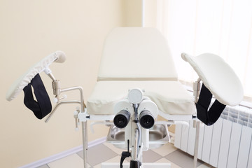 Gynecological chair in gynecological room