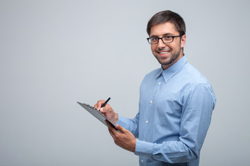 Handsome young man is working with attention