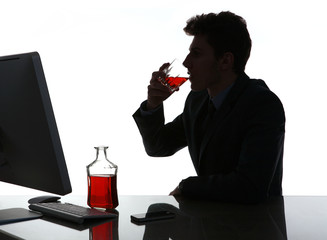 Silhouette of alcoholic drunk young man drinking rum 