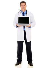 young doctor showing laptop blank screen