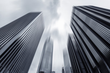 Fototapeta na wymiar low angle view of modern skyscraper exterior and sky