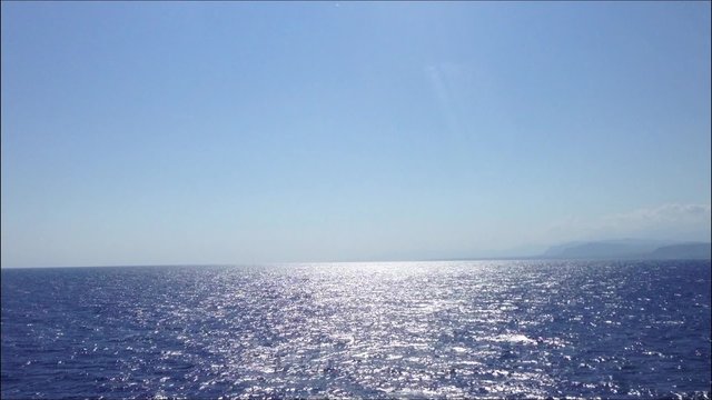 View over the Aegean sea and sky horizon with Santorini Island taken from the boat Folegandros to Santorini, Greece 2013