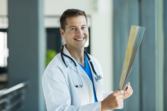 medical intern holding x-ray