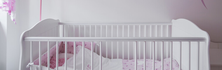 Obraz na płótnie Canvas White crib in baby room