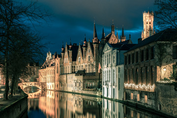 Night tower Belfort and the Green canal in Bruges
