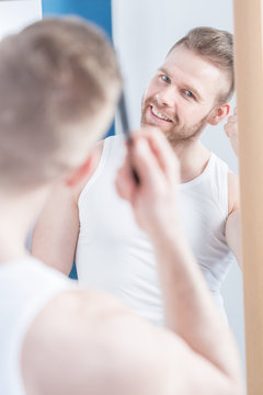 Man brushing hair