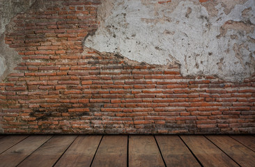 Red brick with cement walls and wooden floors.
