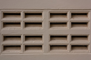 Cement walls have openings for ventilation in and out.