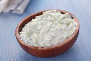 Tzatziki in a wooden bowl
