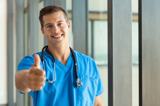 male medical nurse giving thumb up