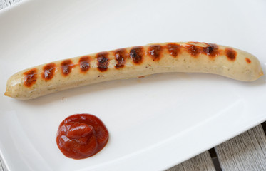 Grilled sausage on plate.