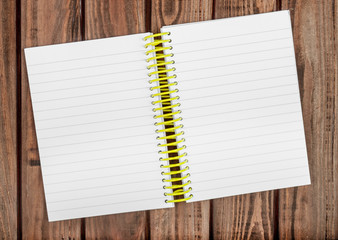 Blank notepad on a wooden surface.