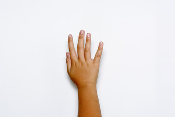 Boy raising five fingers up on hand on white background.
