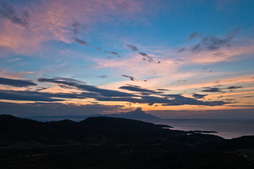 Greek coast of aegean sea at sunrise near holy mountain Athos