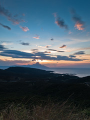 Greek coast of aegean sea at sunrise near holy mountain Athos