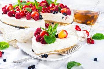 Cheesecake with berries and mint, summer dessert.