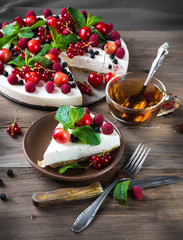 Cheesecake with berries and mint, summer dessert.