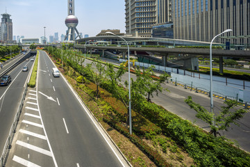 cityscape of shanghai and traffic on road