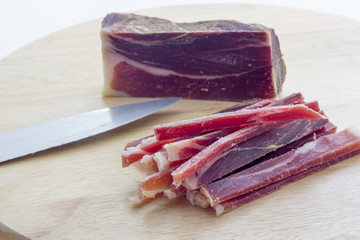 Strips of raw bacon